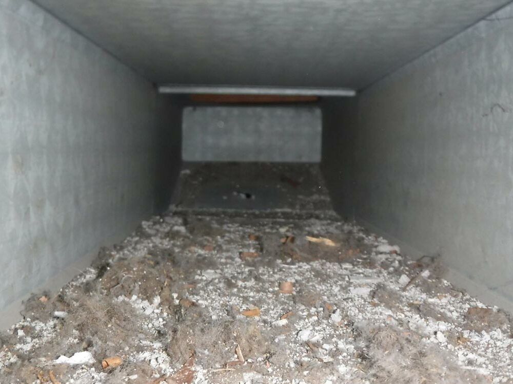 Inside view of an air duct before cleaning by air duct pros